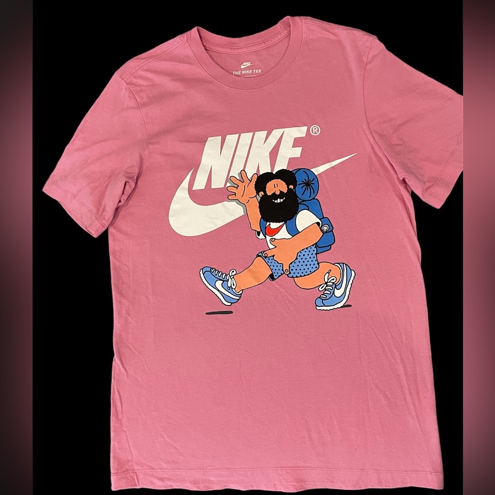 Nike small T-shirt with graphic on front.